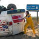 Jenna Fischer crowbars open a wreck ambulance door (Photo: Ilze Kitshoff/WTTV Productions Limited)